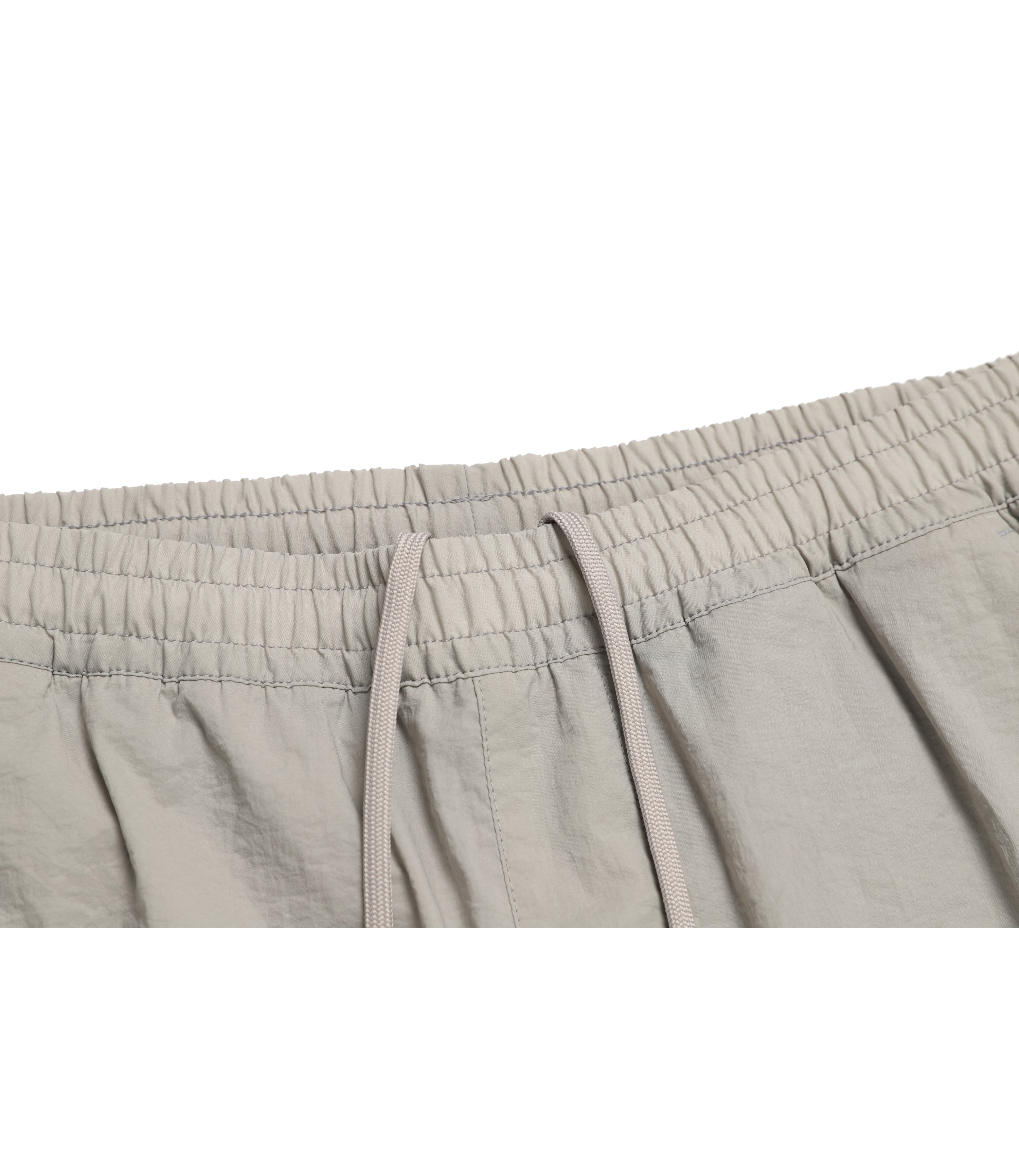 Unisex DIMER Woven Training Tapered Pants<br>OAK BEIGE