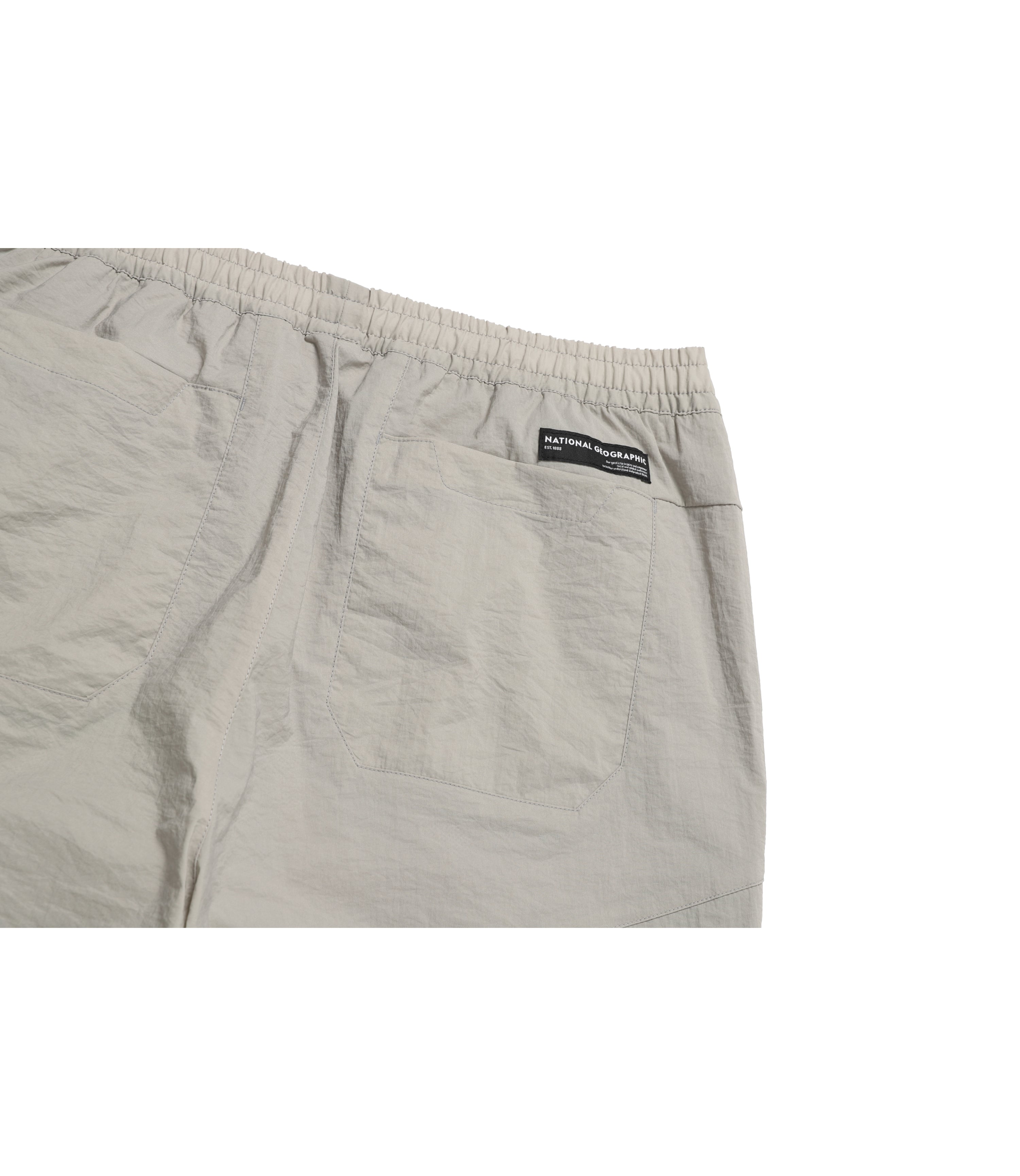Unisex DIMER Woven Training Tapered Pants<br>OAK BEIGE